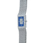 The Piaget Tradition Lapis Lazuli Diamond Dress Watch is a luxury silver wristwatch featuring a blue rectangular face and a textured metal band.
