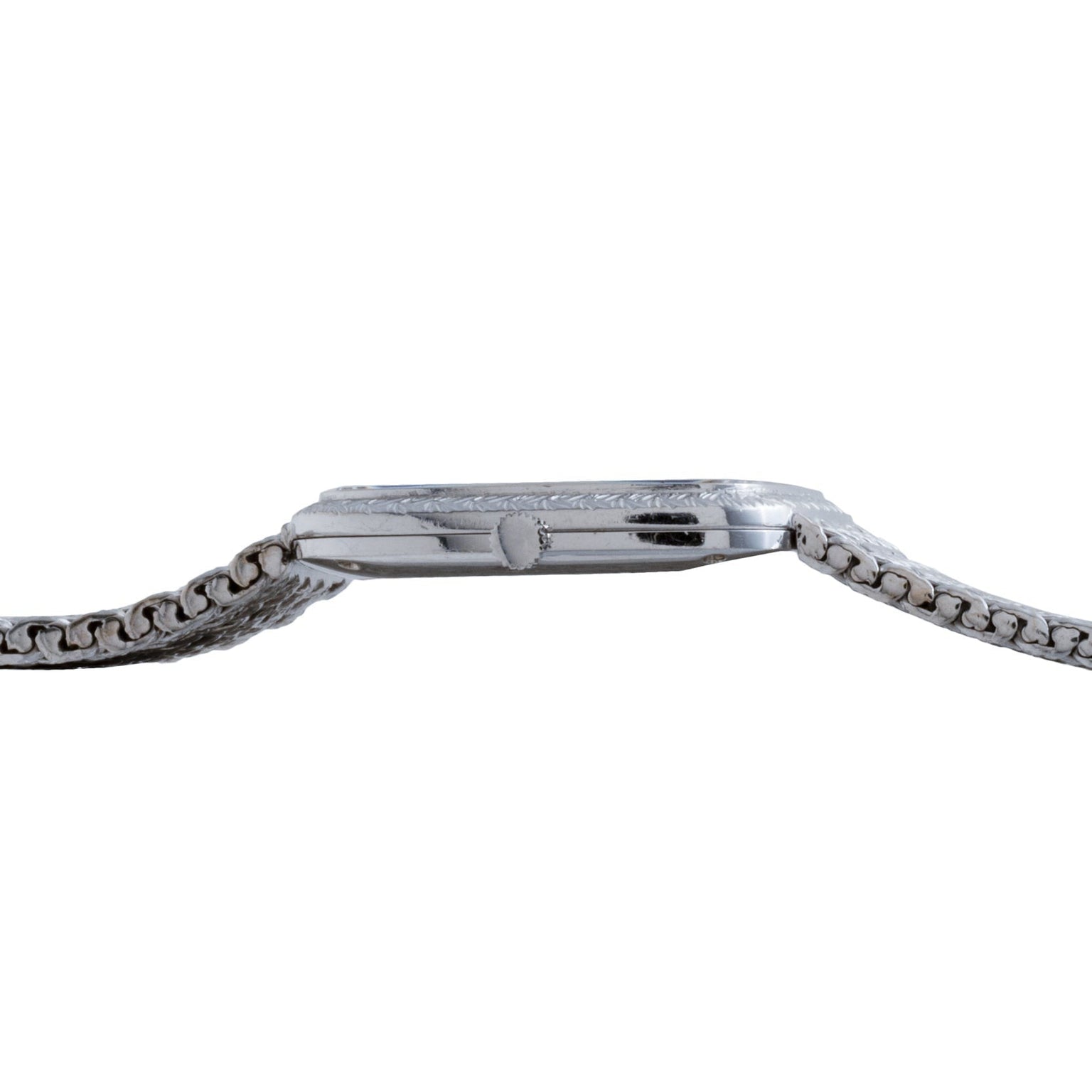 Side view of the Piaget Hawk Eye White Gold Dress Watch featuring a silver metal band and a slim watch face.