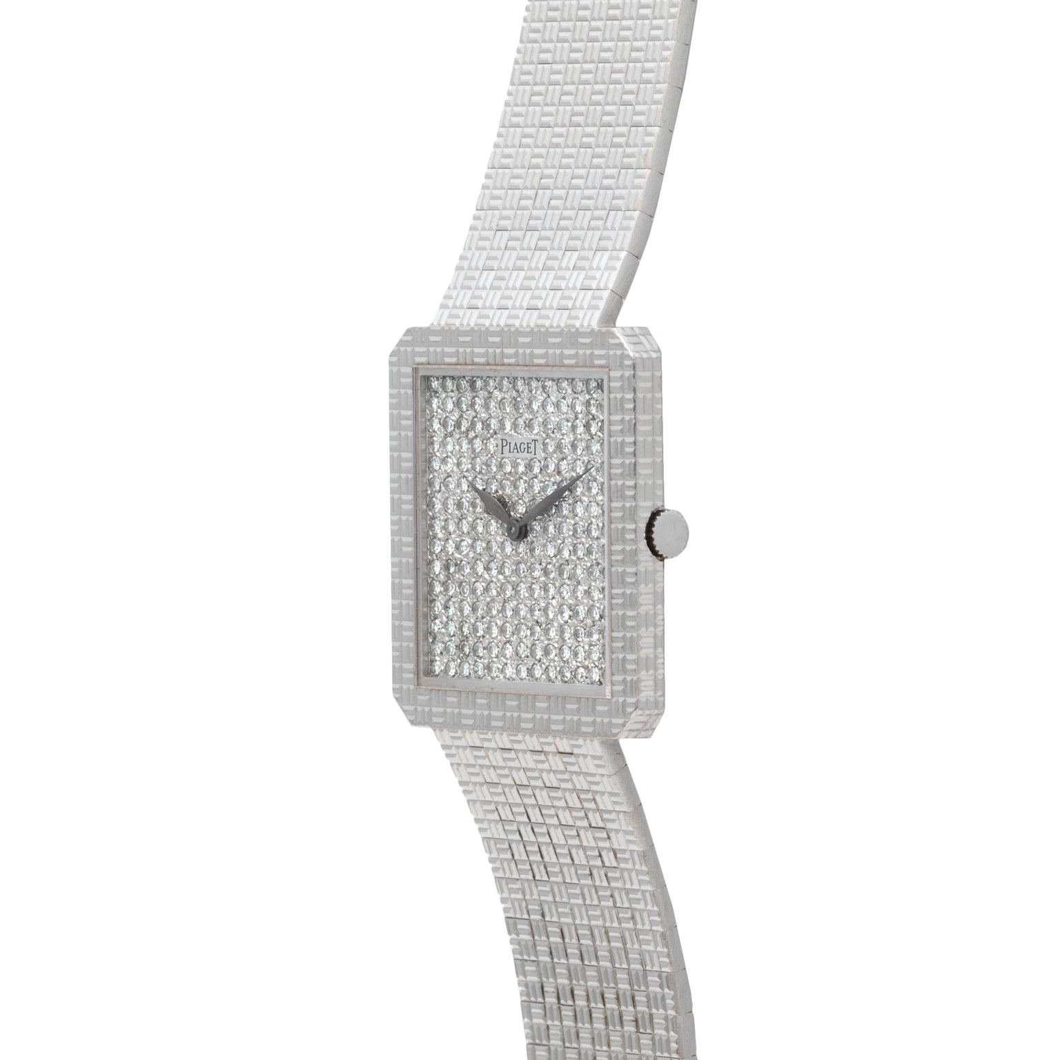 The Piaget Brick Diamond Dress Watch features a square face, silver finish, textured band, and a diamond-encrusted dial.