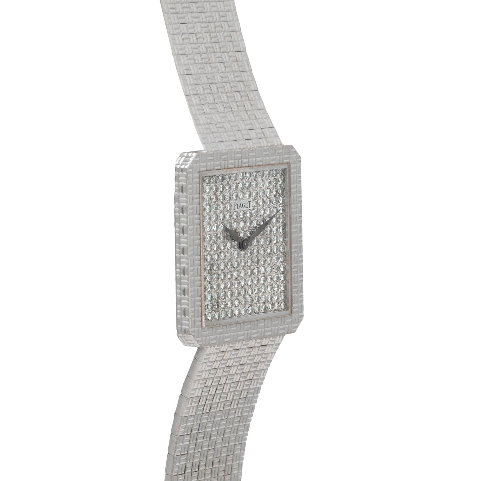 The Piaget Brick Diamond Dress Watch is a luxury silver wristwatch featuring a square diamond-encrusted face and a textured metal band.