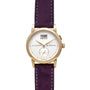 Lange & Sohne Saxonia Outsize Date gold wristwatch with white dial, purple leather strap, date window, and small seconds subdial.
