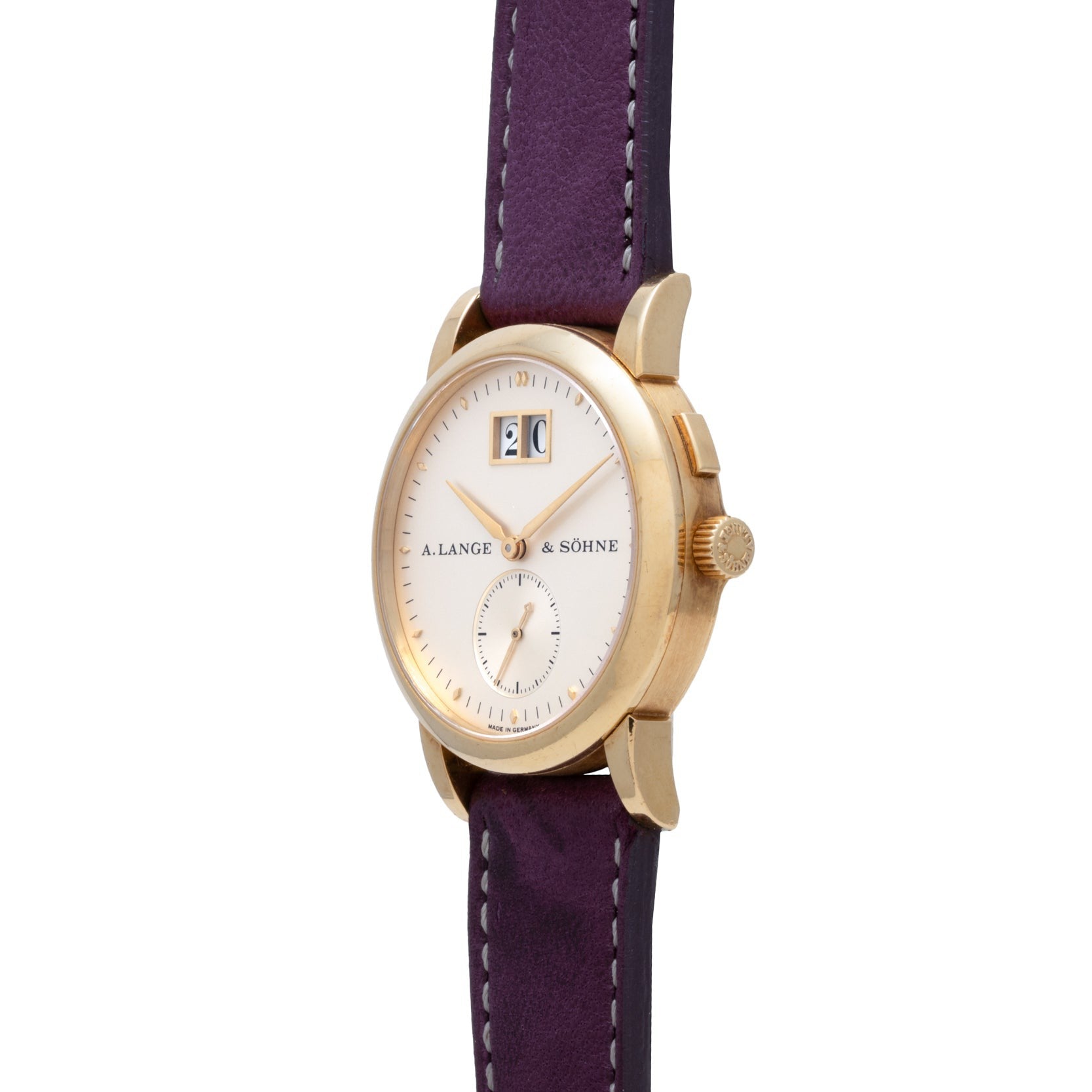 The Lange & Sohne Saxonia Outsize Date features a gold case, white dial, and purple leather strap.