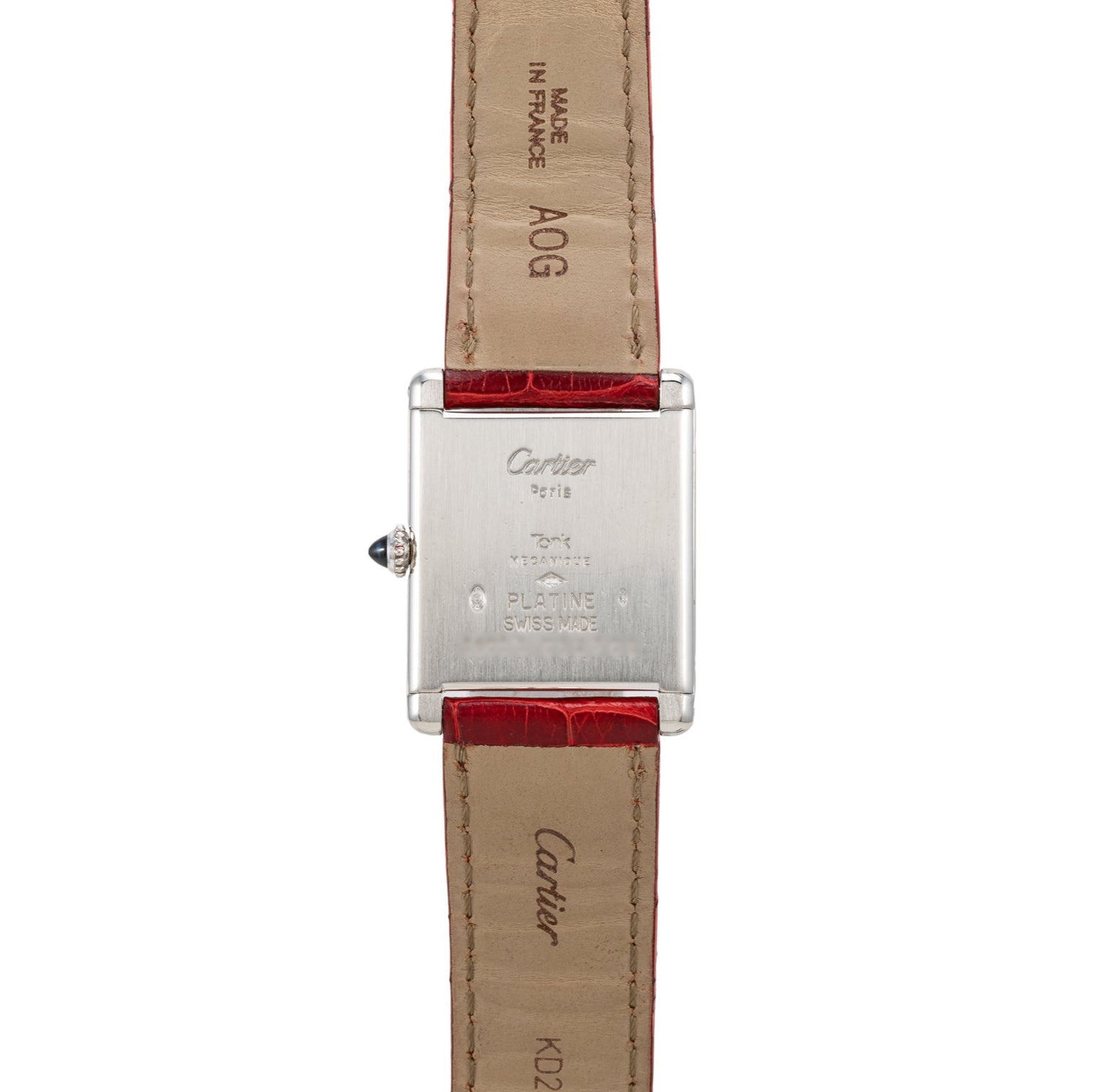 Back view of the Cartier Tank Louis watch featuring a red leather strap and engraved details on the metal case and strap.