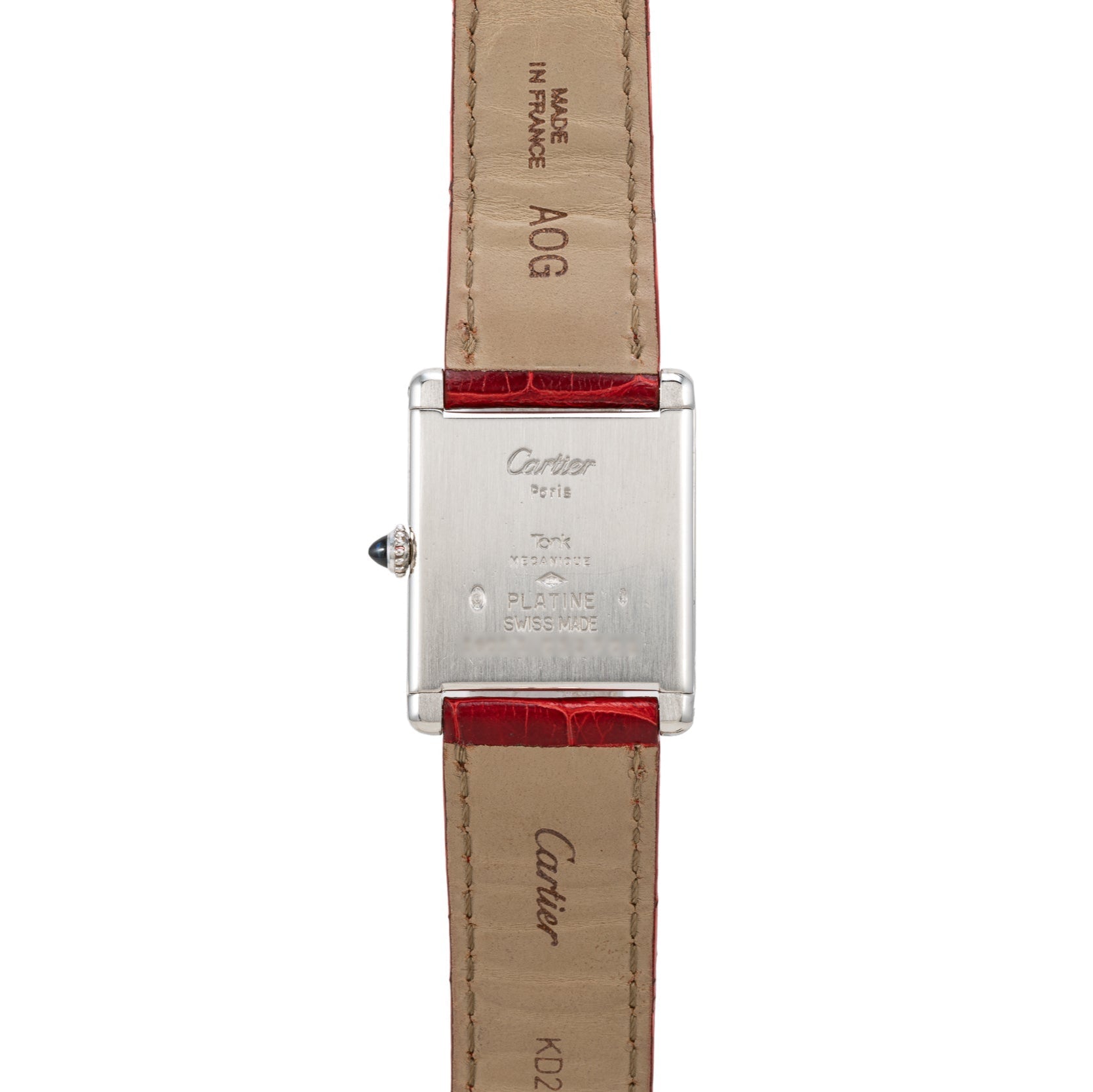 Back view of the Cartier Tank Louis watch featuring a red leather strap and engraved details on the metal case and strap.