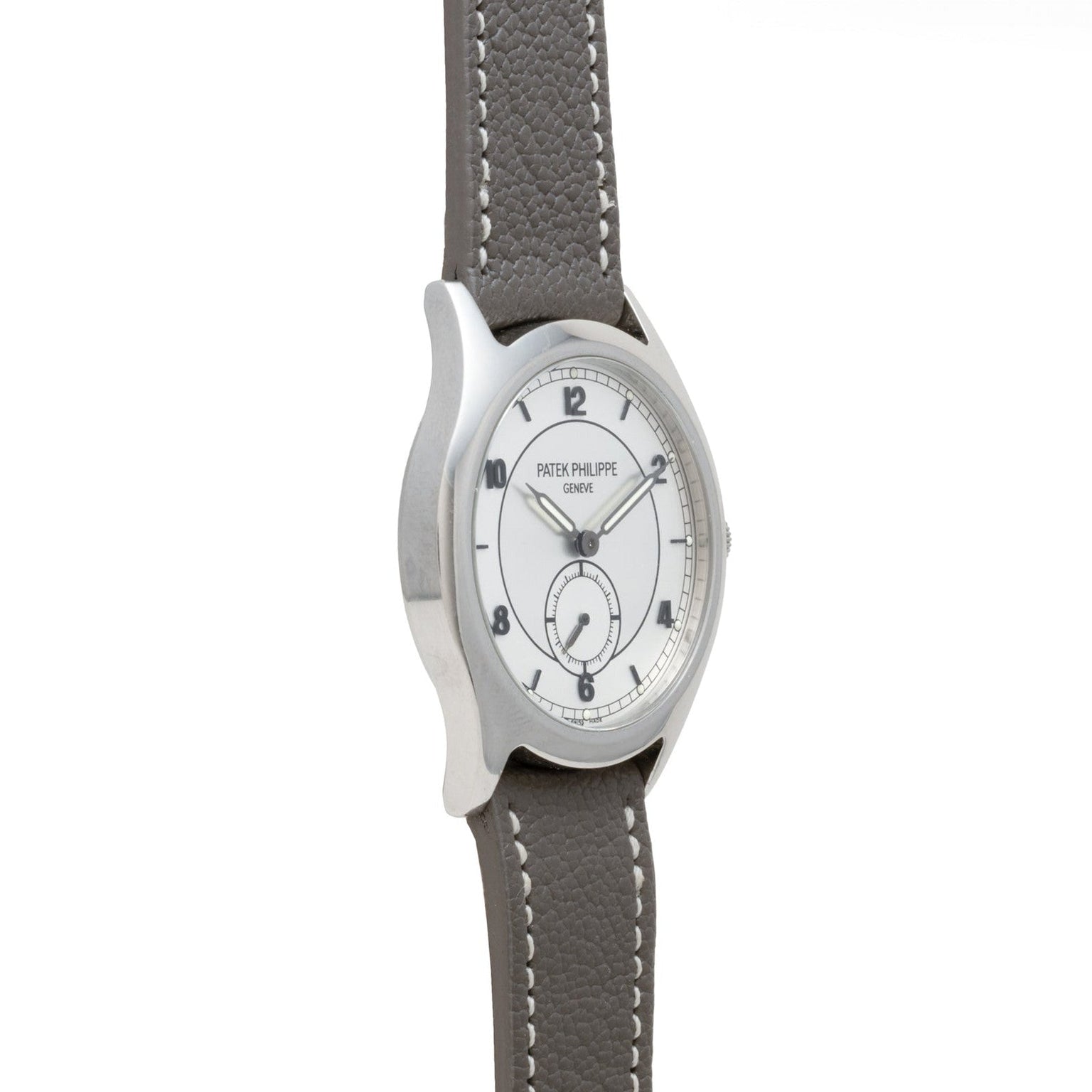 A silver Patek Philippe Calatrava Geneva Boutique Limited Edition wristwatch with a white dial and gray leather strap, displayed at an angle.