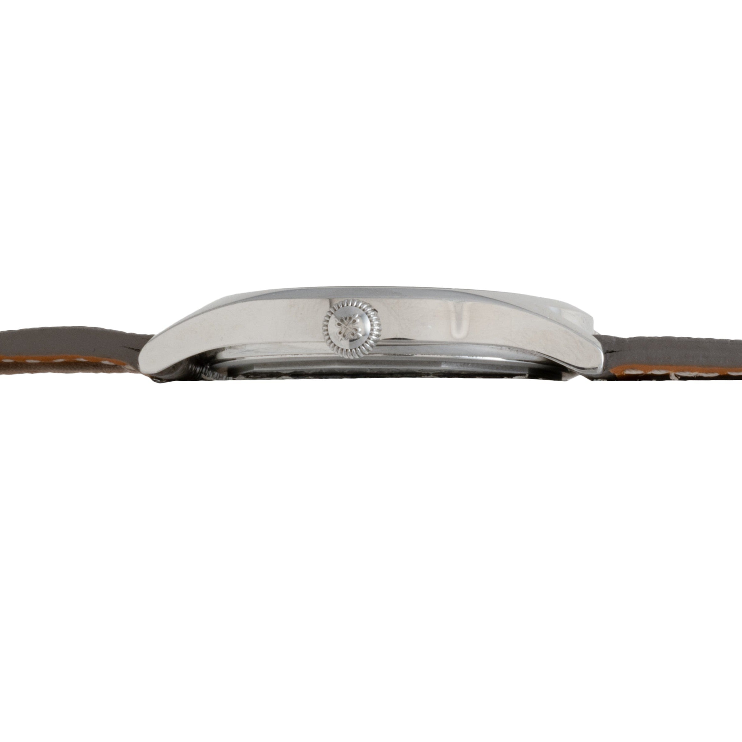 Side view of the Patek Philippe Calatrava Geneva Boutique Limited Edition wristwatch with a silver case and brown leather strap shown against a white background.