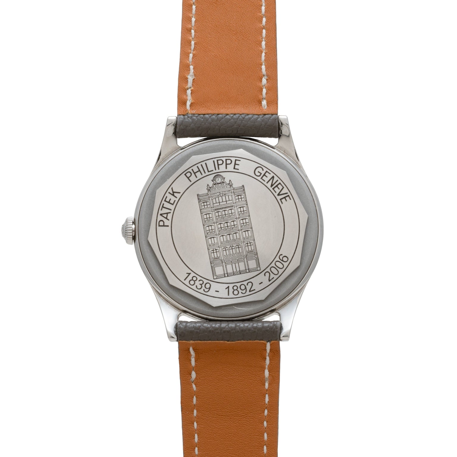 The Calatrava Geneva Boutique Limited Edition by Patek Philippe features a wristwatch back engraved with a building, the dates 1839-1892-2006, and “Patek Philippe Genève.”.