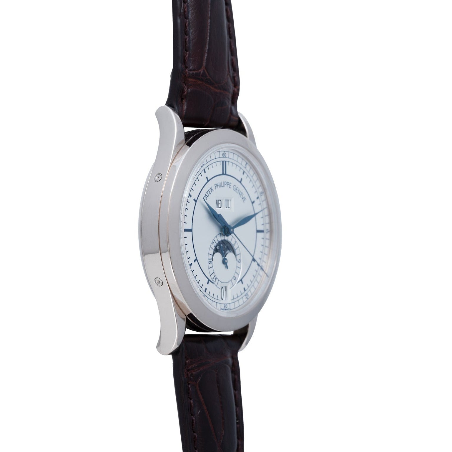 Patek Philippe Annual Calendar wristwatch with a brown leather strap, moonphase display, and blue hands, shown from a side angle.
