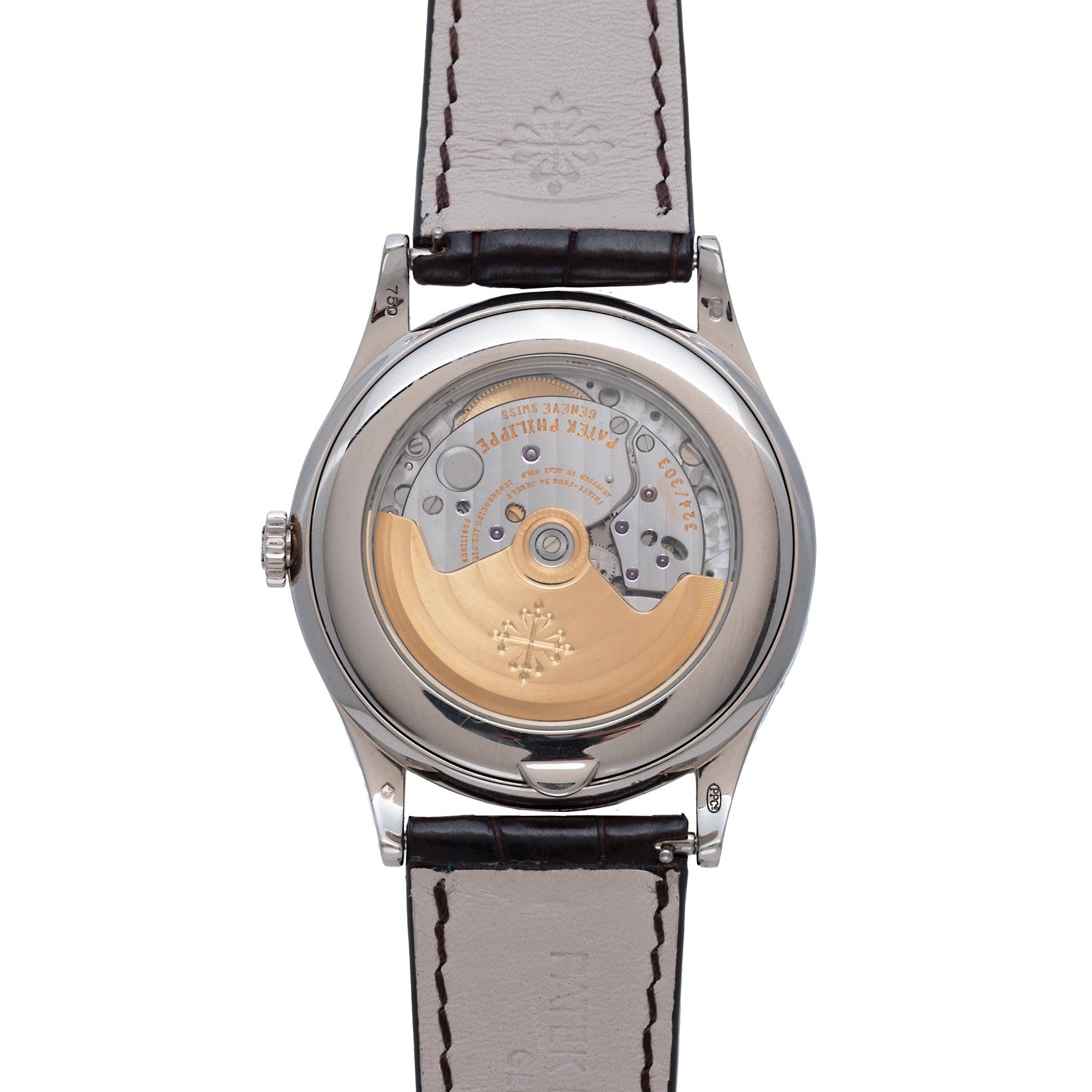 Close-up of the Patek Philippe Annual Calendars transparent case back, showcasing its intricate automatic movement and elegant leather strap.