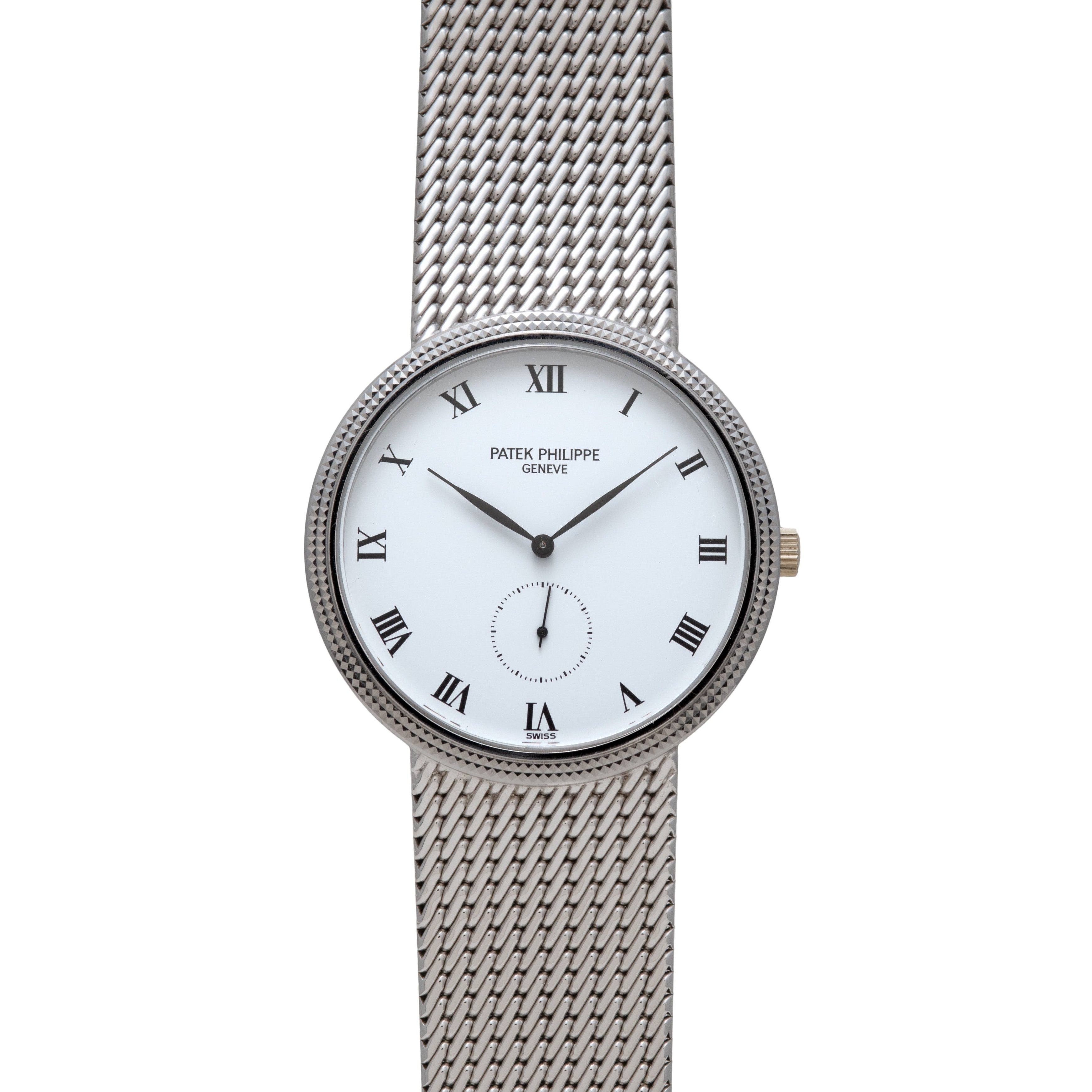 The Patek Philippe Calatrava is a silver watch with a white face, Roman numerals, and a mesh metal band.