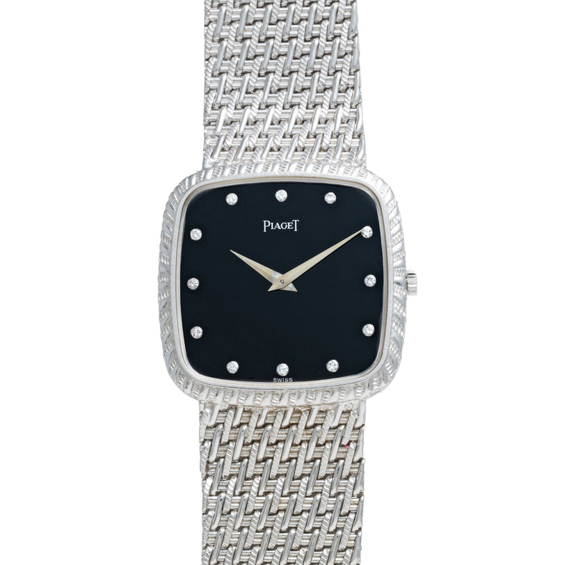A Piaget Onyx Dial White Gold Dress Watch featuring a textured band and a black square dial with diamond hour markers.