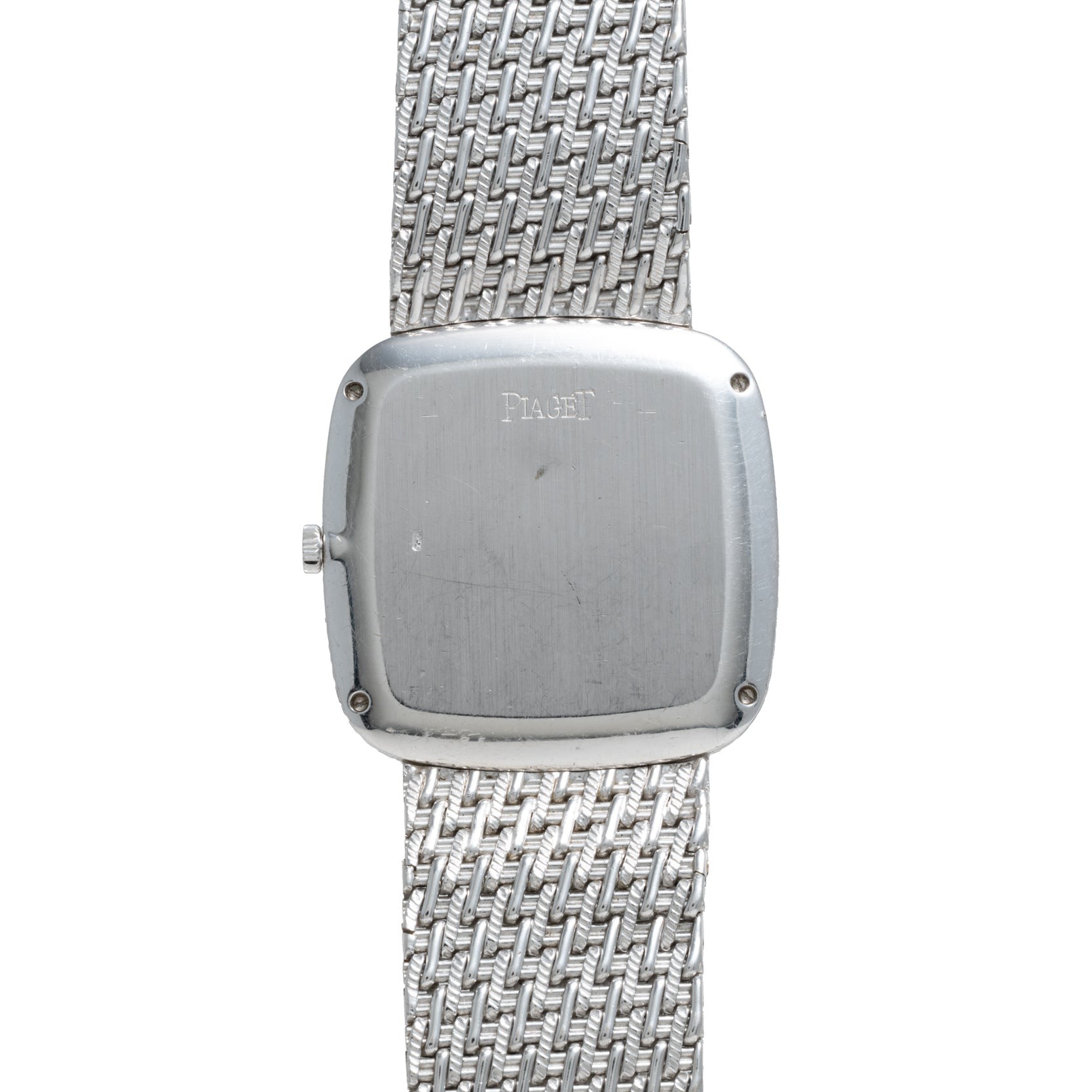 A Piaget Onyx Dial White Gold Dress Watch featuring a woven metal band and a plain, square back case engraved with PIAGET.