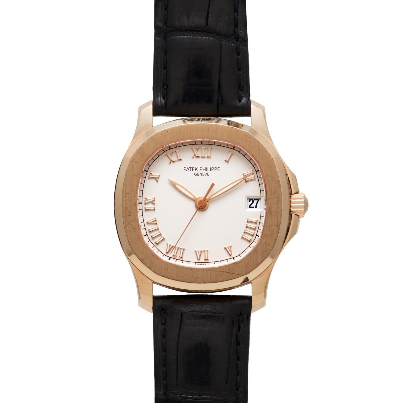 Patek Philippe Aquanaut watch with Roman numerals, black leather strap, and date display at 3 o’clock.