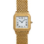 A Cartier Santos Dumont gold wristwatch featuring a square face, Roman numerals, and a mesh band.