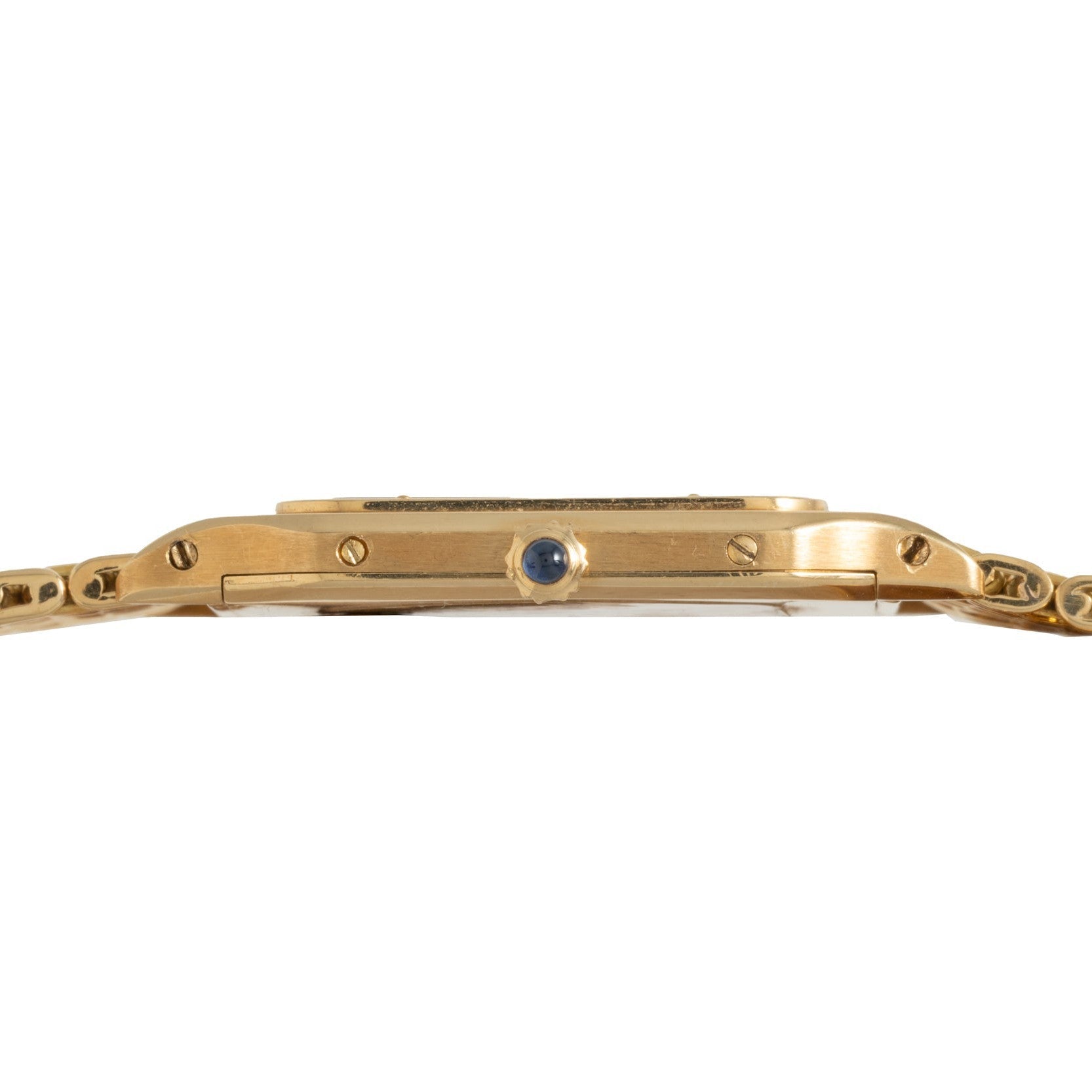 Side view of the Cartier Santos Dumont gold wristwatch featuring a round blue crown and visible screws on the case.