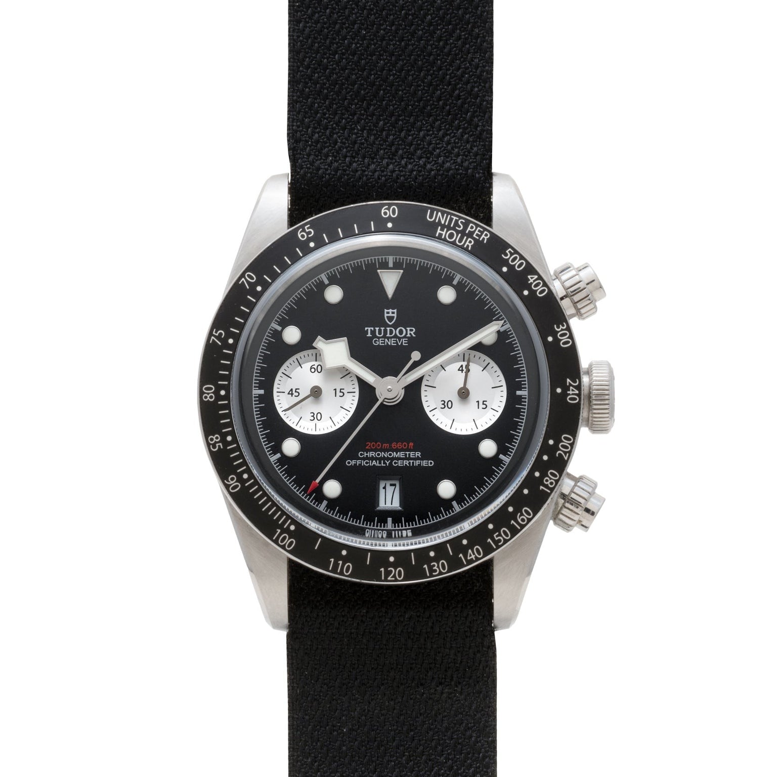 The TUDOR Black Bay Chronograph is a black wristwatch with a black strap and two white subdials on its face.