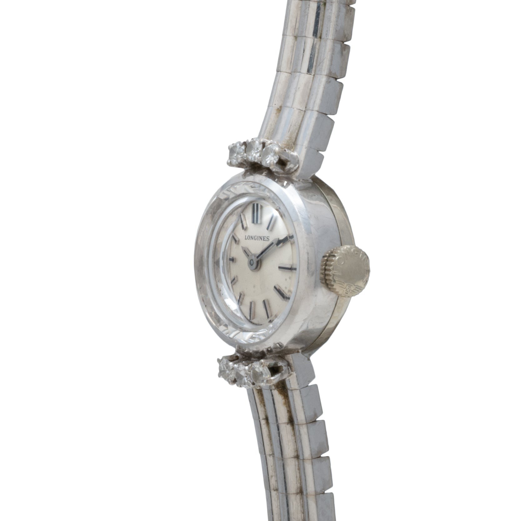 Side view of the Longines Diamond Cocktail Watch featuring a round face, diamond accents, and a silver metal band.