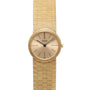 Piaget 18K Yellow Gold Dress Watch featuring a round face, minimalist design, and textured gold band.