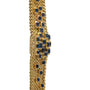 Yellow Gold Integrated Dress Watch by Patek Philippe, featuring woven gold links and a central cluster of rectangular blue gemstones.