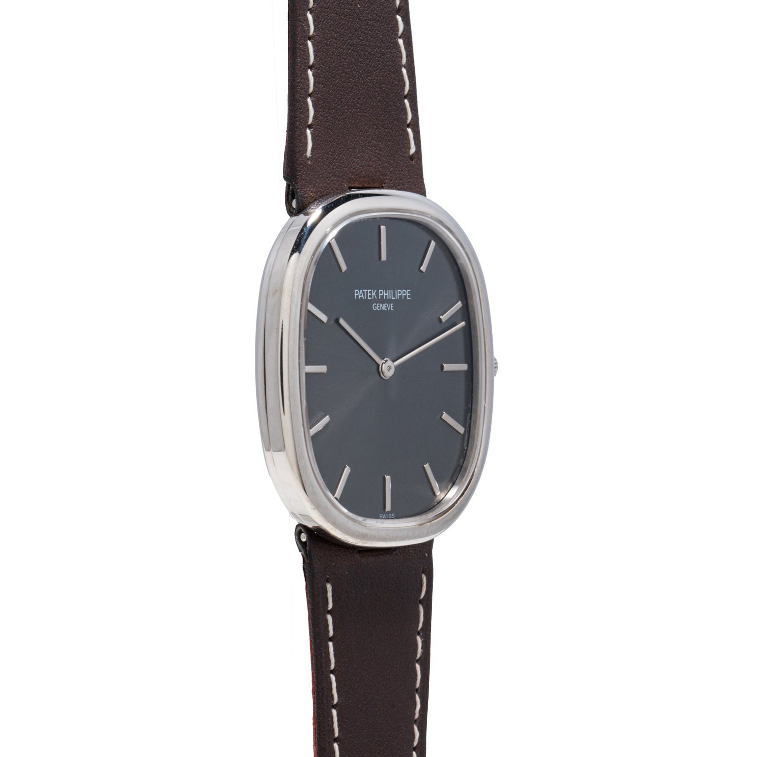 A Patek Philippe Ellipse wristwatch featuring a silver case, black face, and brown leather strap.