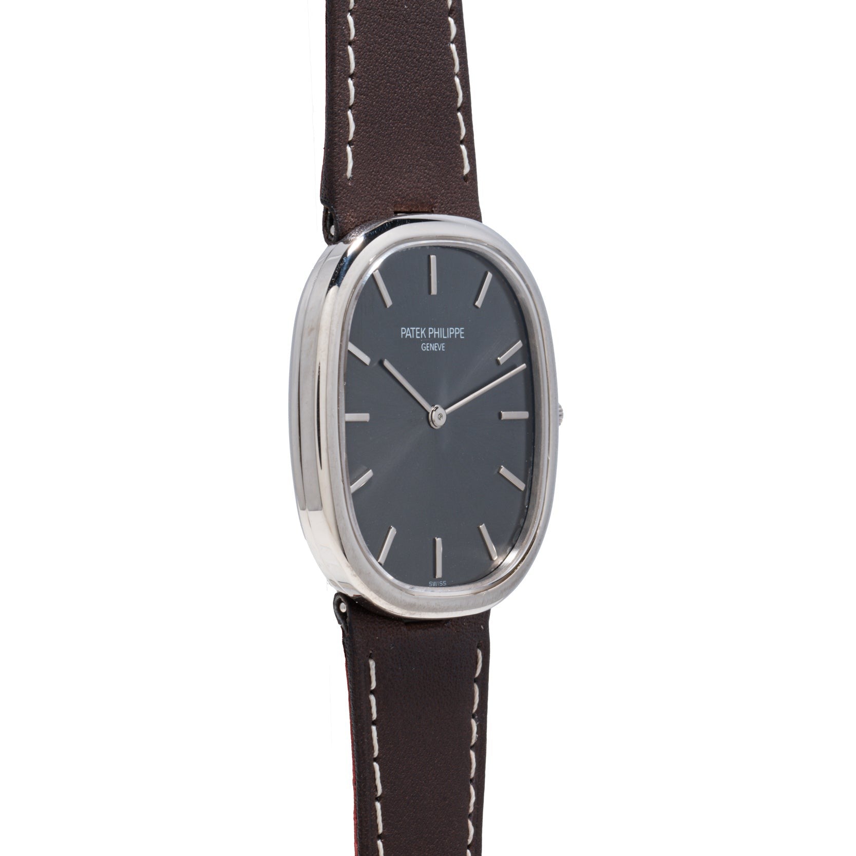 A Patek Philippe Ellipse wristwatch featuring a silver case, black face, and brown leather strap.