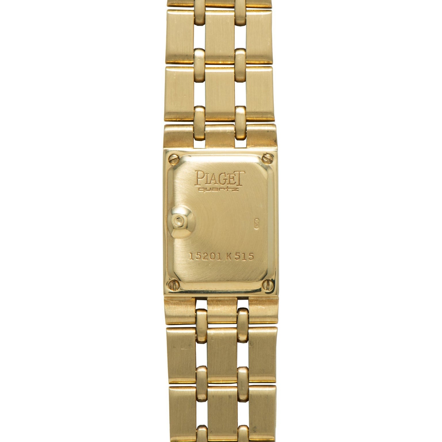 Close-up of the back of a Piaget Polo Pave gold wristwatch, featuring engraved text and a linked bracelet.