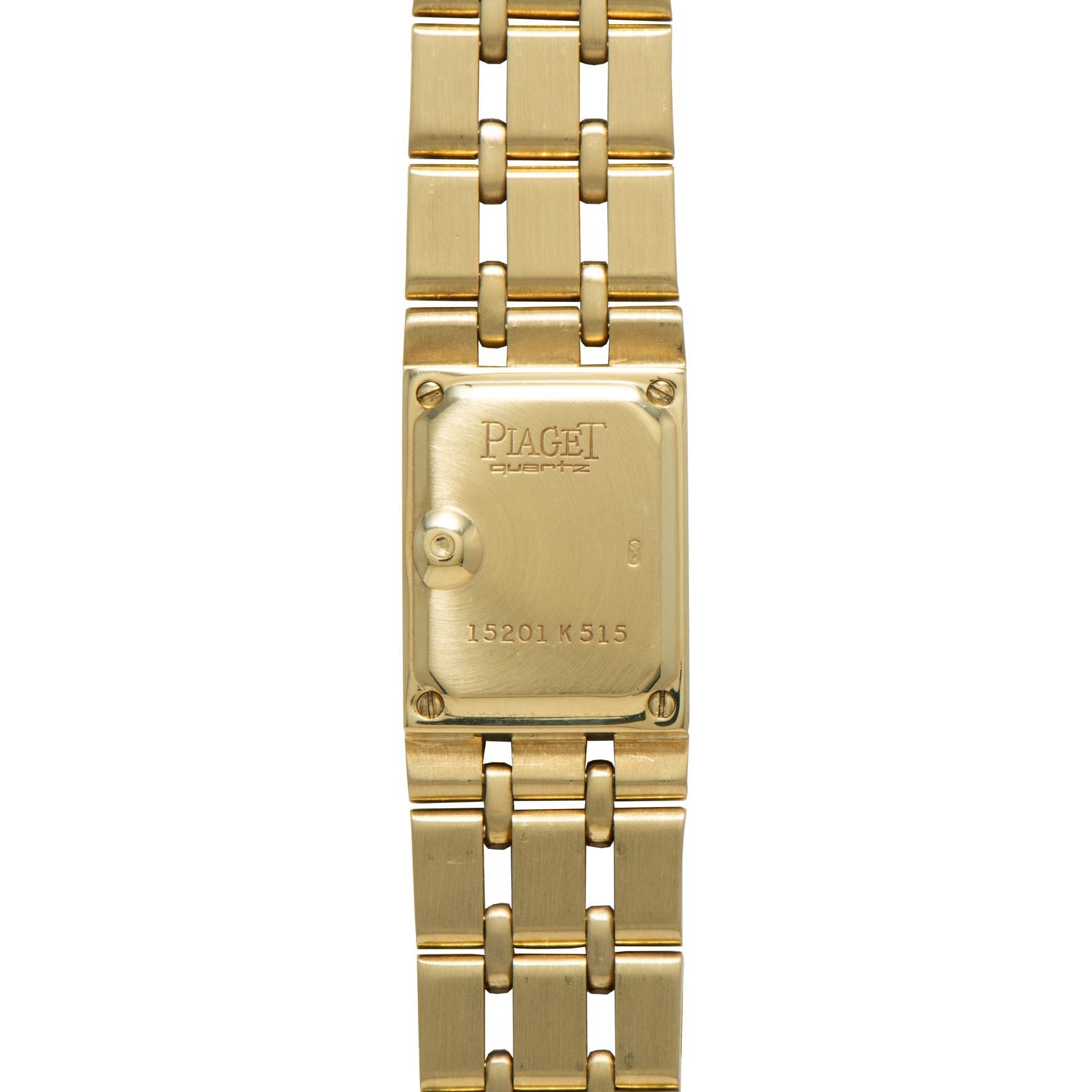 Close-up of the back of a Piaget Polo Pave gold wristwatch, featuring engraved text and a linked bracelet.