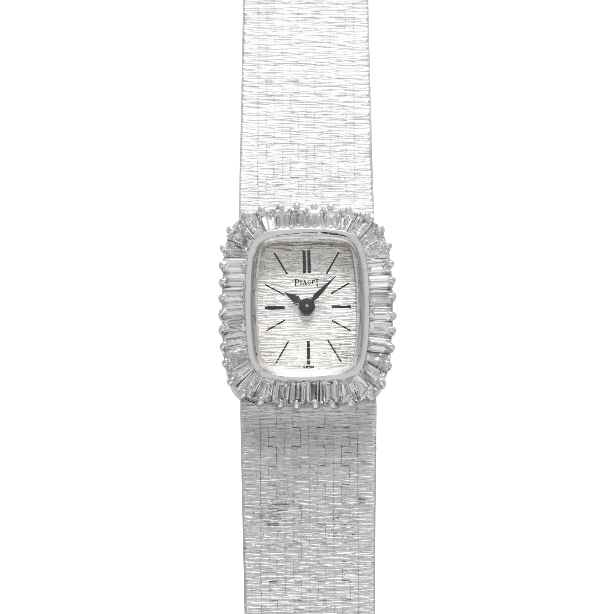 A luxurious Piaget White Gold Bark Diamond Dress Watch featuring a textured band and a diamond-encrusted rectangular face set to 10:09.