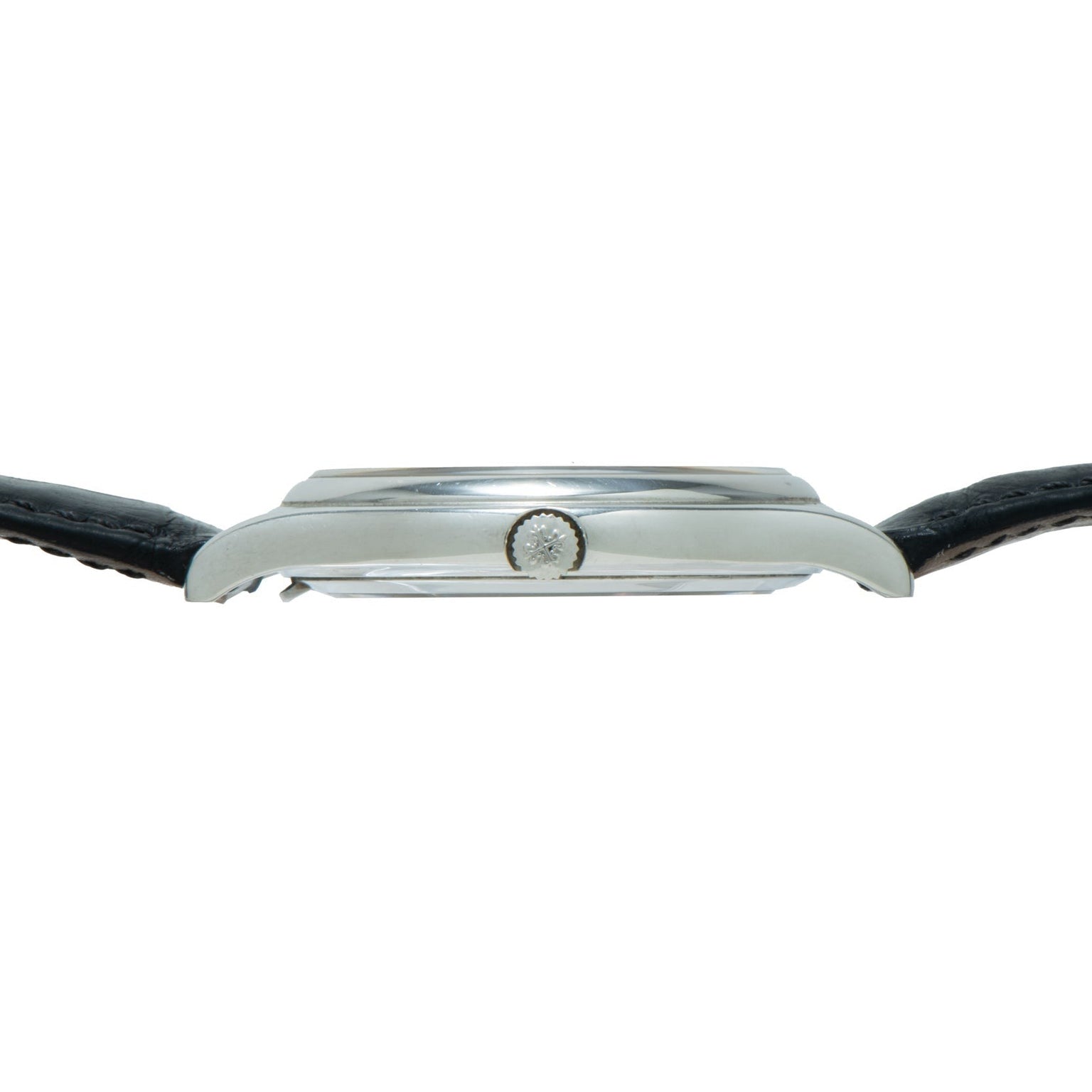 Side view of the Patek Philippe Perpetual Calendar, a silver wristwatch featuring a black leather strap and a small central crown.