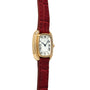 Gold Cartier Gondole Ladies wristwatch with a white face, Roman numerals, and a textured red leather strap.
