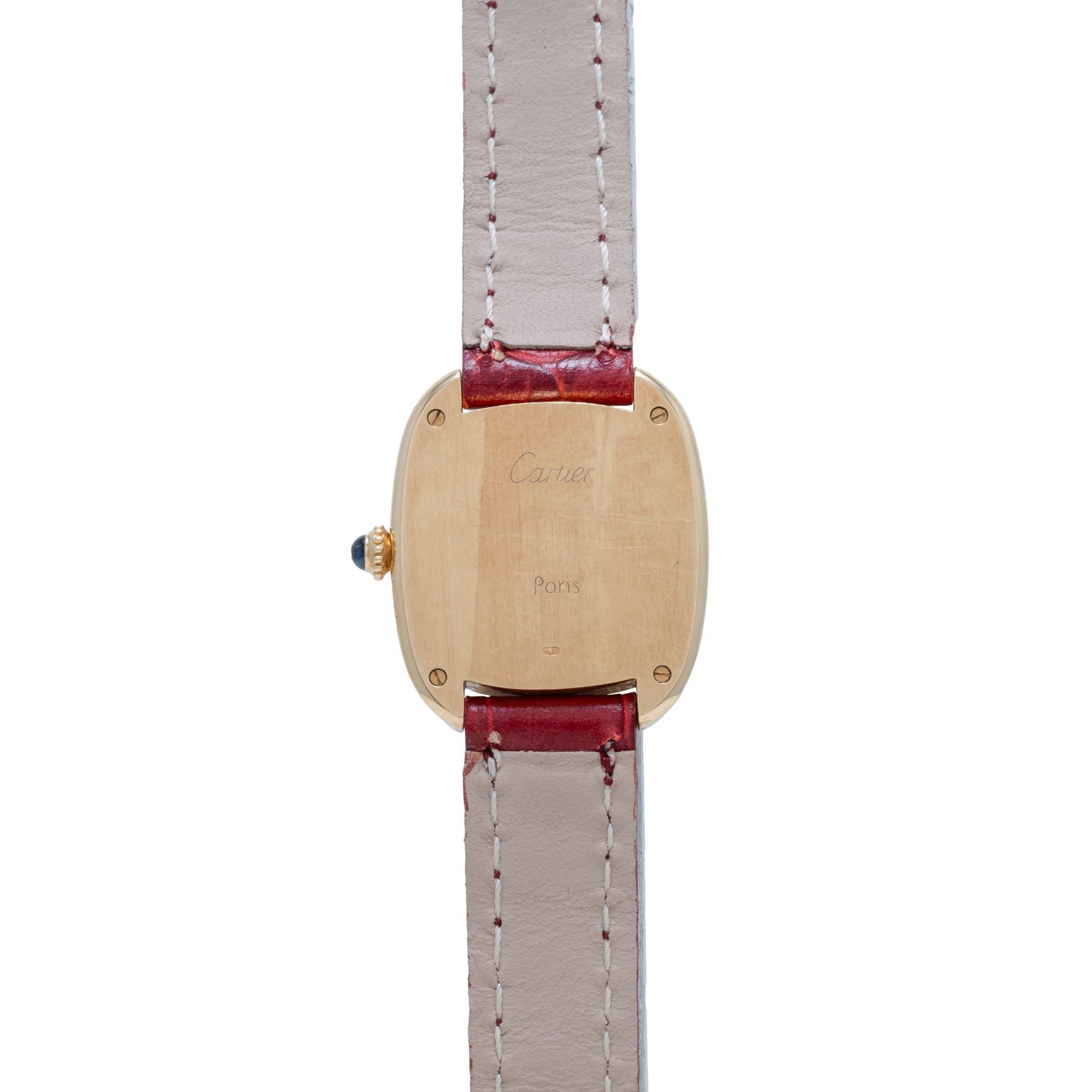 The Cartier Gondole Ladies watch features a gold case with a beige leather strap and red trim, shown from the back to display its engravings.