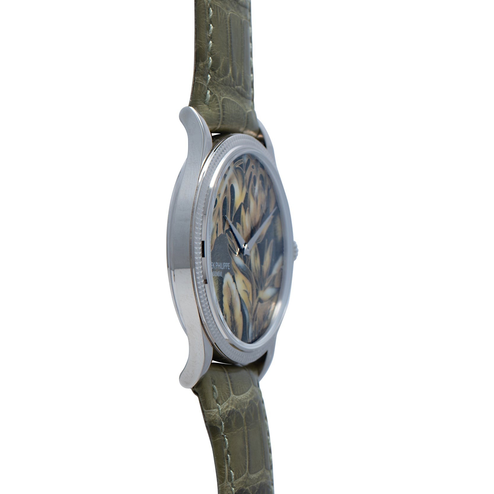 Side view of the Patek Philippe Calatrava Cloisonné Tropical Leaves II wristwatch, featuring a leaf-patterned face and a green leather strap.