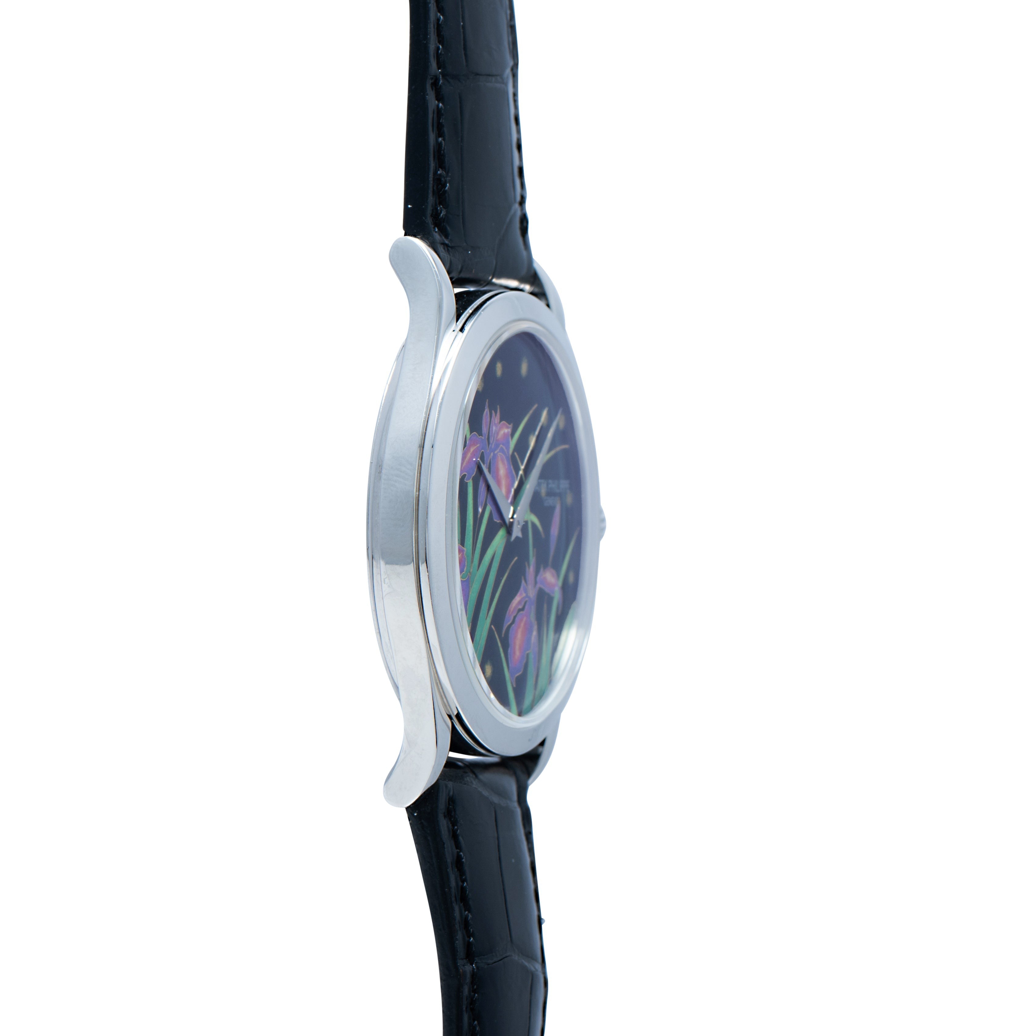 Side view of the Patek Philippe Calatrava Cloisonné Iris & Night Fireflies wristwatch, featuring a black leather strap and a floral design on the watch face.