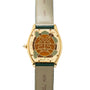 Cartier Tortue XL Turtle Limited Edition watch featuring a leaf motif and green leather strap, shown from the back to highlight its detailed engravings.