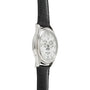 Side view of a Patek Philippe Annual Calendar Moonphase wristwatch featuring a silver case, white dial, black leather strap, multiple subdials for the annual calendar, moon phase display, and date window.