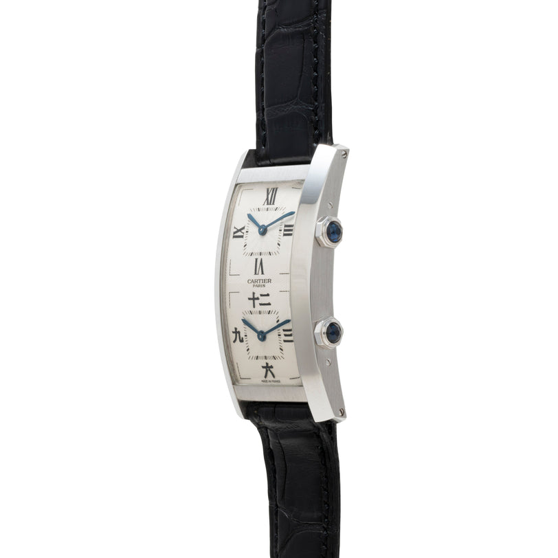Side view of the Cartier Tank Cintrée CPCP Dual-Time wristwatch featuring dual dials, a black leather strap, and a silver rectangular case.