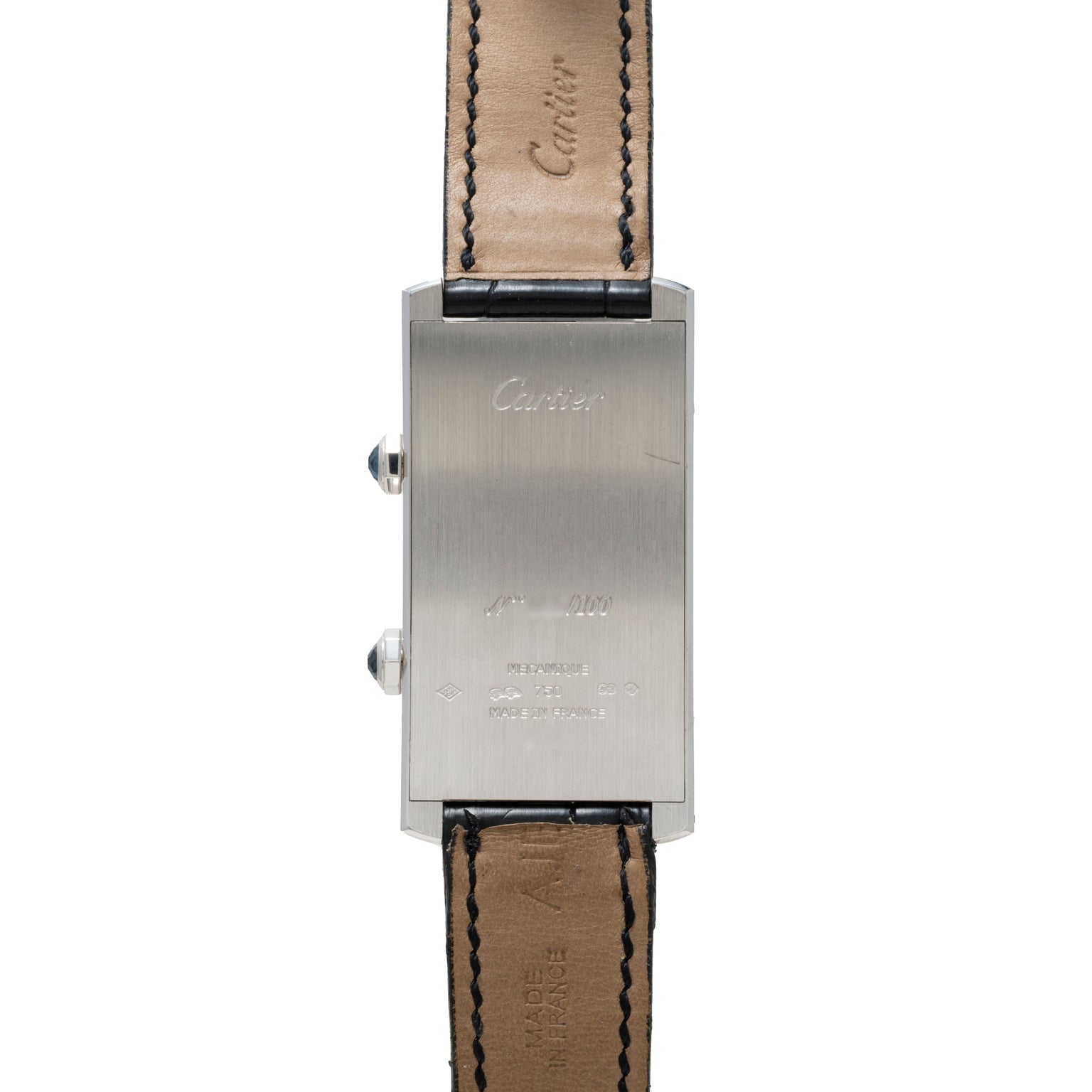 Back view of the Cartier Tank Cintrée CPCP Dual-Time, featuring a rectangular case with engraved text and leather straps.