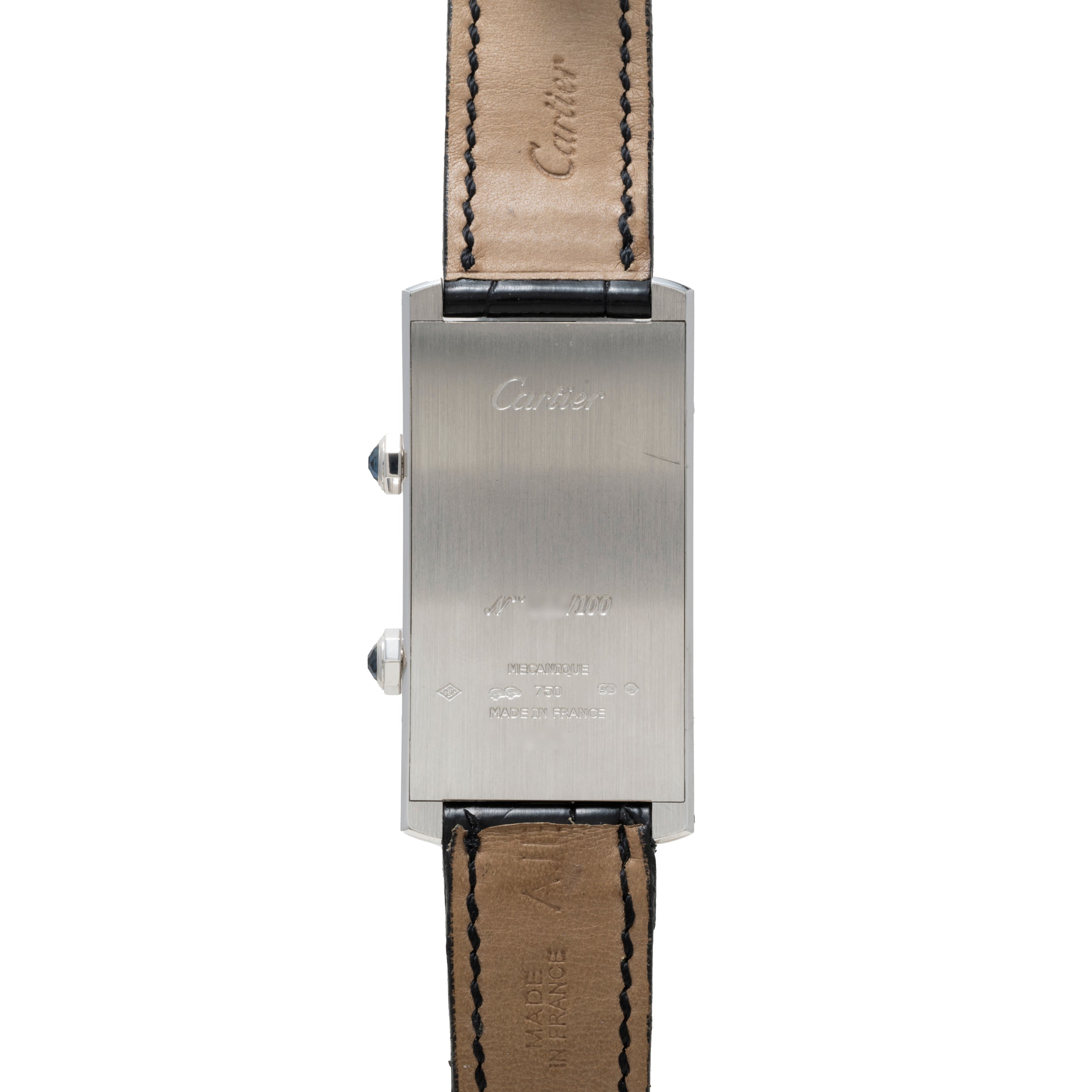 Back view of the Cartier Tank Cintrée CPCP Dual-Time, featuring a rectangular case with engraved text and leather straps.