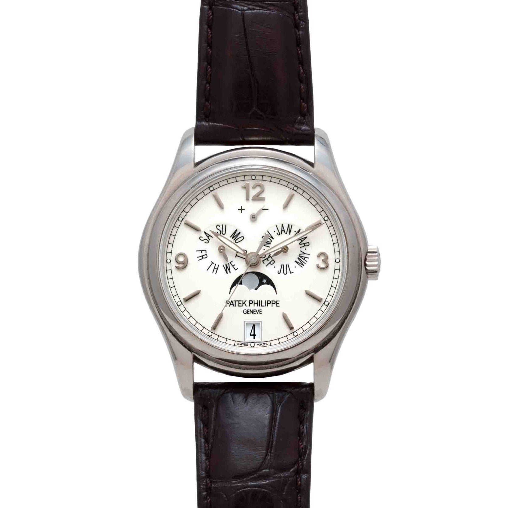 A Patek Philippe Annual Calendar Moonphase watch in silver with a white dial, black leather strap, and displays for date and moon phase.