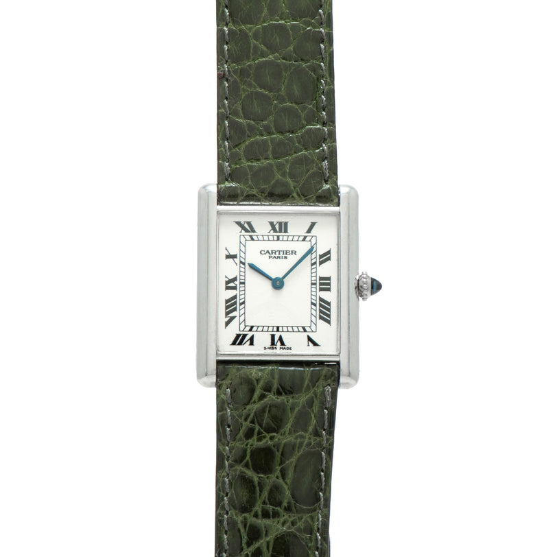 The Cartier Tank Louis CPCP watch features a green leather strap and a square white dial with Roman numeral hour markers.