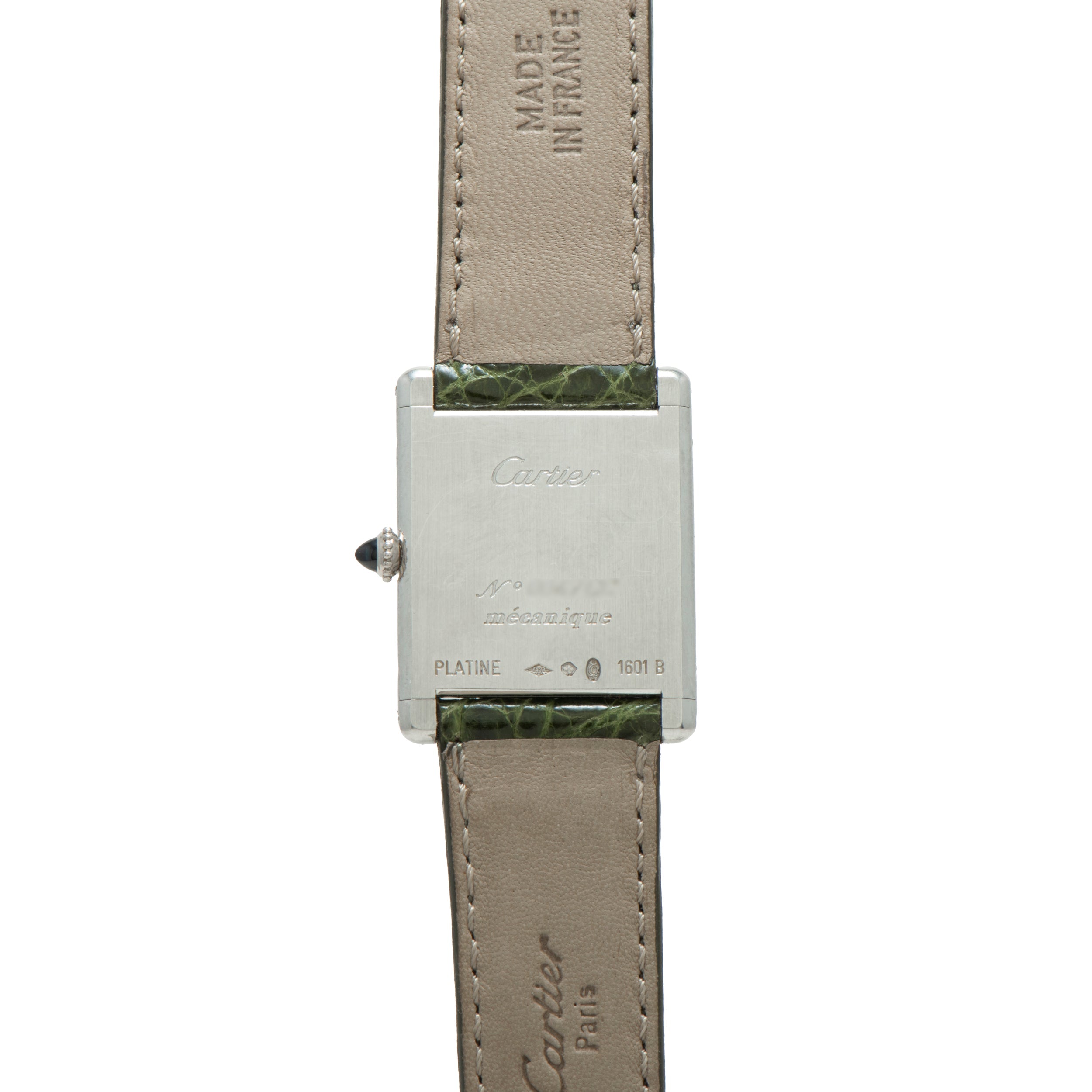 Back of a Cartier Tank Louis CPCP wristwatch with inscriptions, leather strap, and Made in France text.