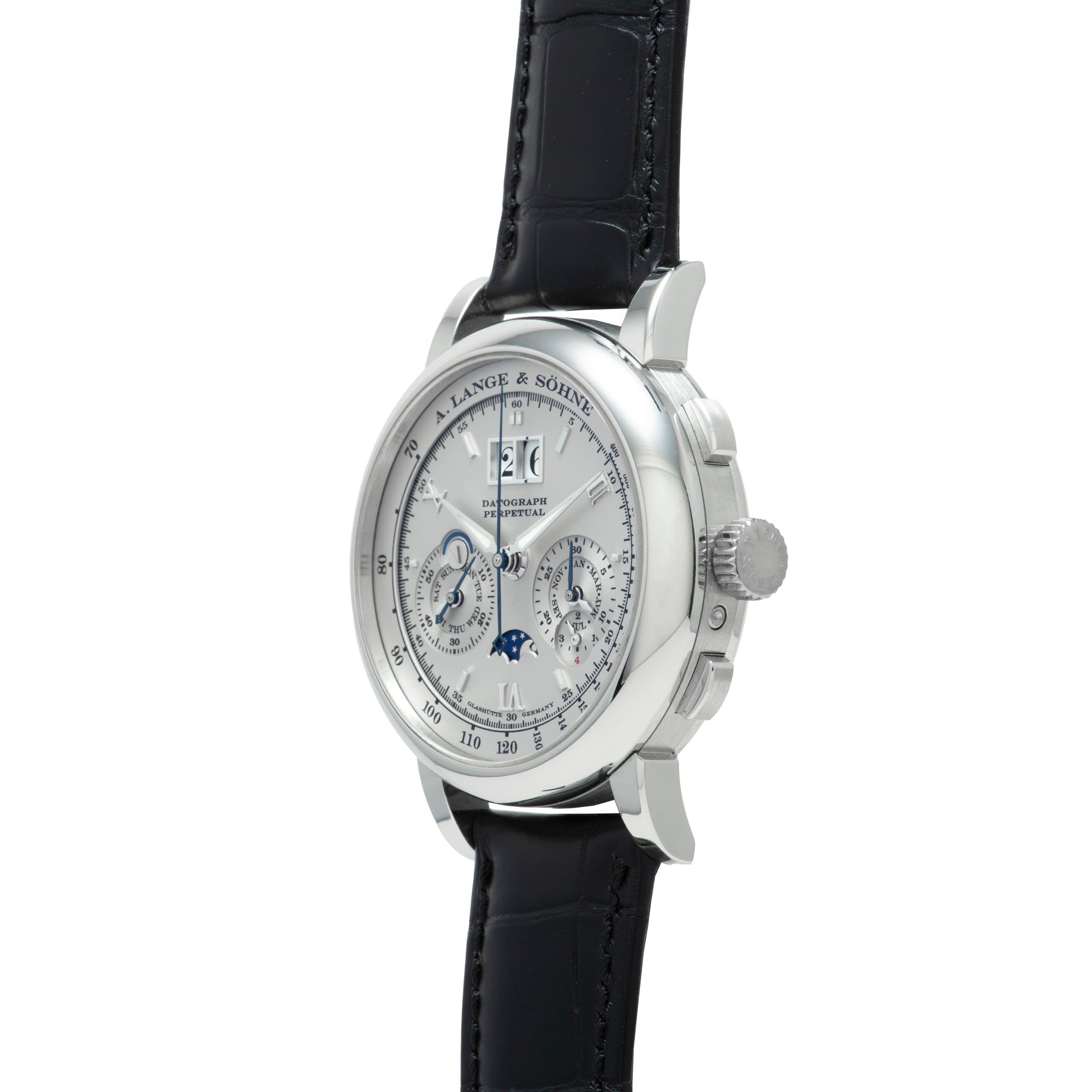 The Lange & Sohne Datograph Perpetual Calendar is a luxury silver wristwatch featuring a black leather strap and multiple subdials on a white face.