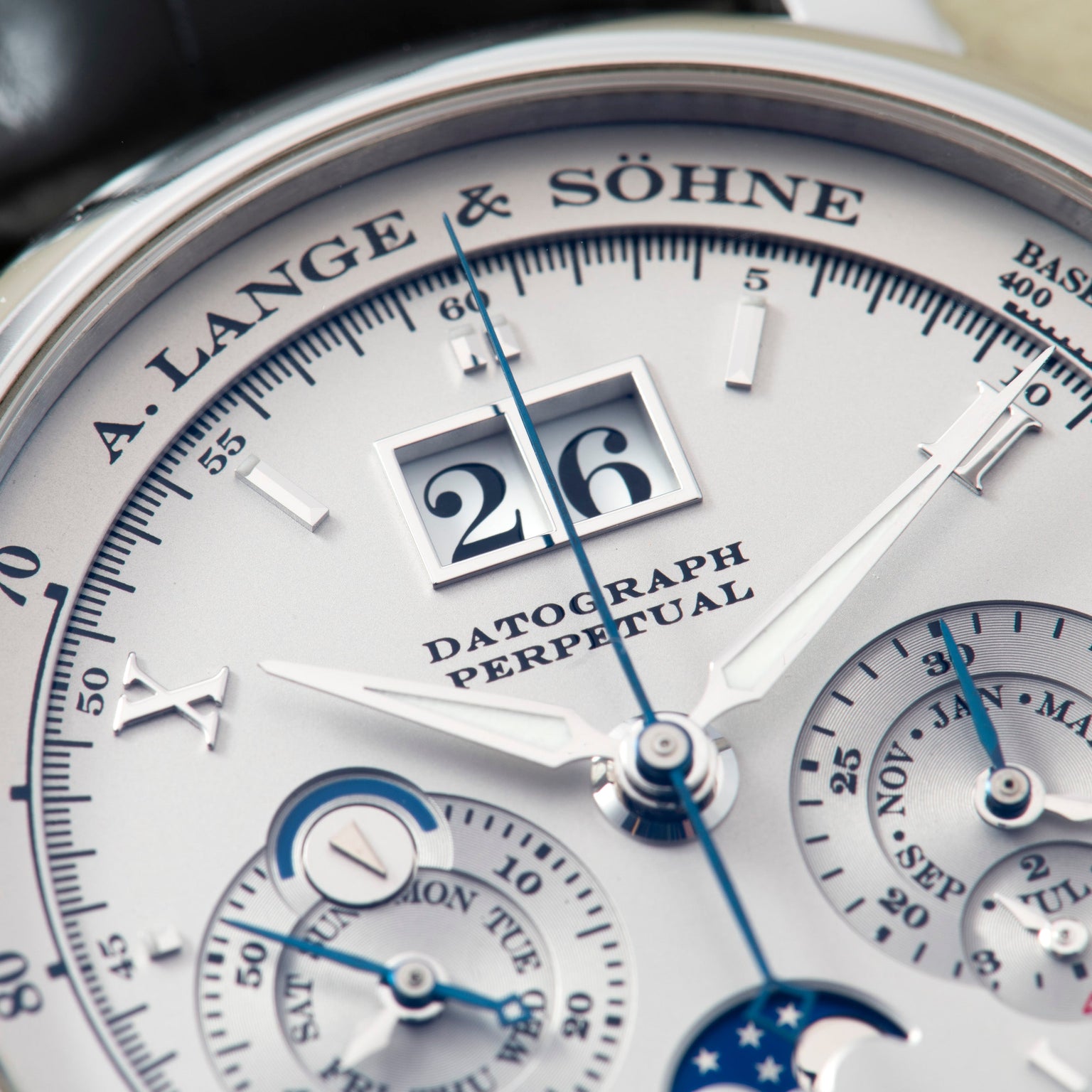 Close-up of a Lange & Sohne Datograph Perpetual Calendar watch face highlighting its detailed dials and date display.