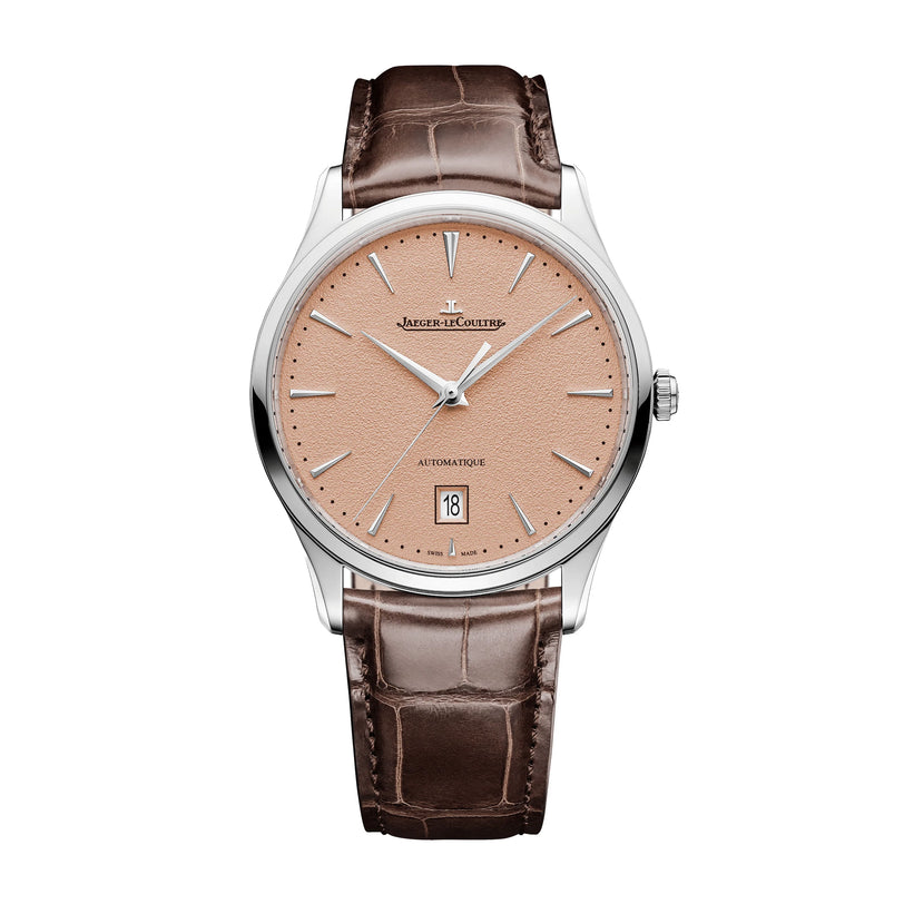 The Jaeger-LeCoultre Master Ultra Thin Date features a light brown textured dial, silver markers and hands, date window at 6 o’clock, brown alligator leather strap, and a steel case for timeless elegance.