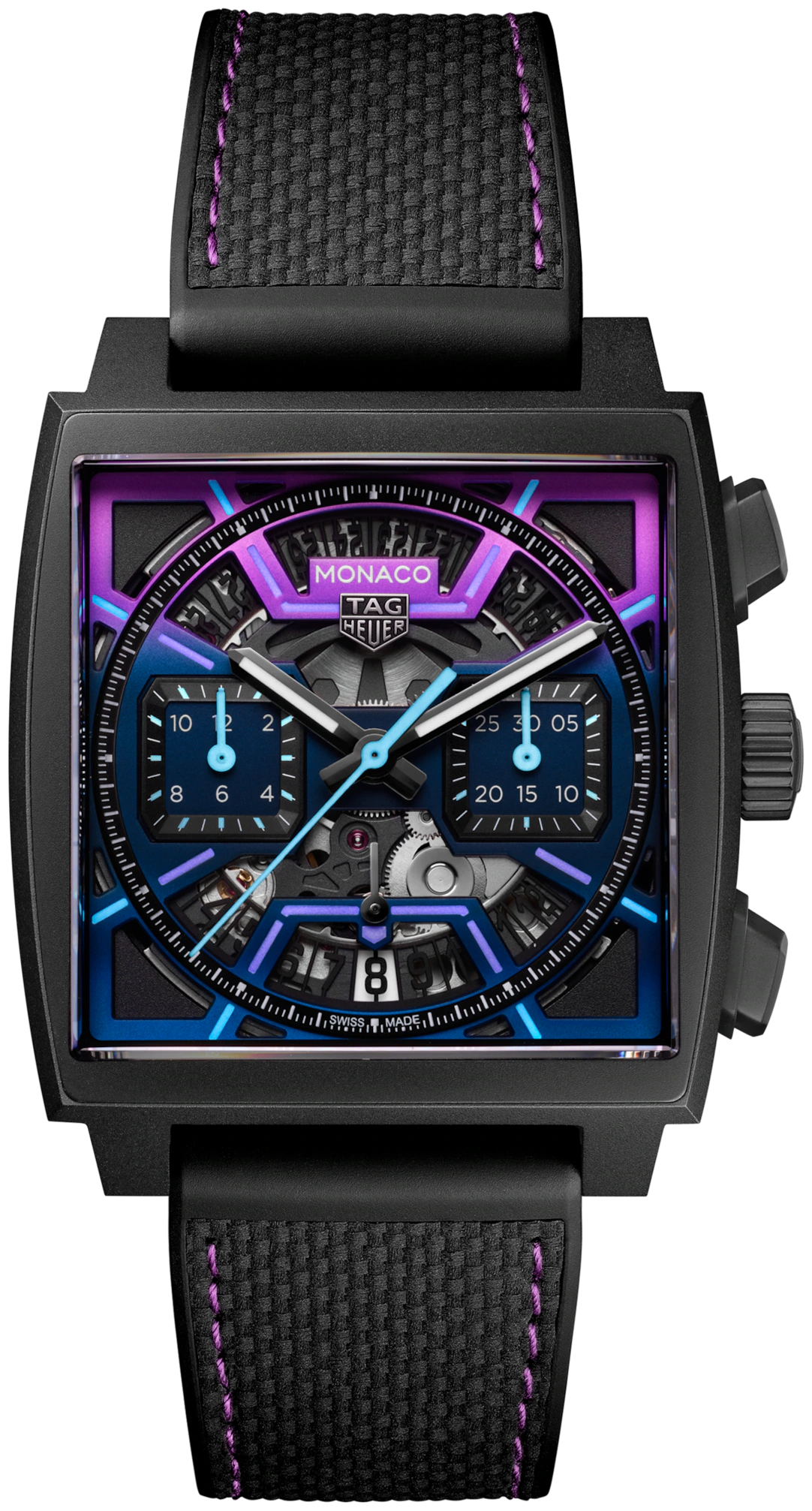 The TAG Heuer Monaco Chronograph Las Vegas Edition features a square titanium DLC-coated case, purple and blue accents, exposed movement, two subdials, and a black textured strap with bold purple stitching.