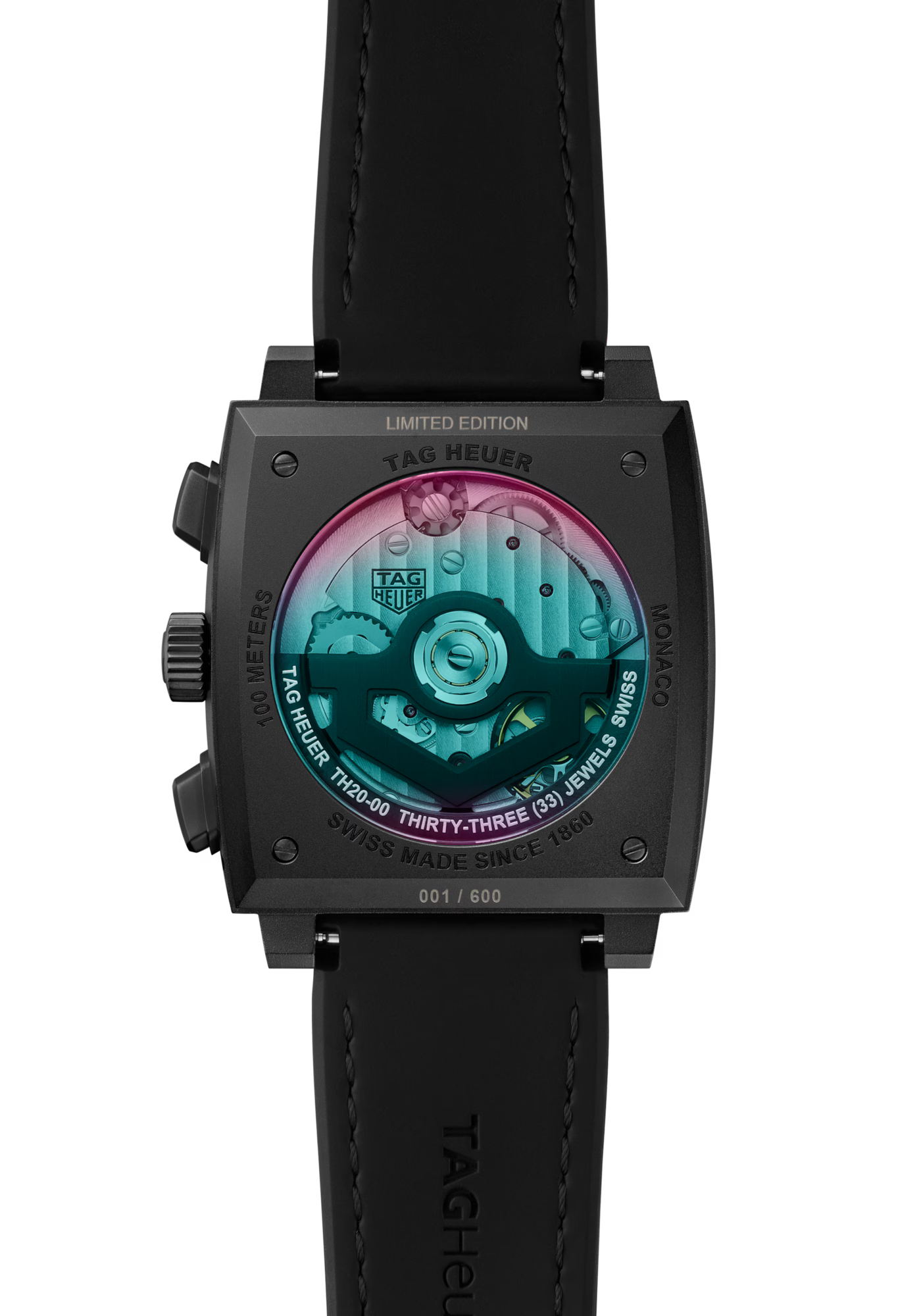 Close-up of the TAG Heuer Monaco Chronograph Las Vegas Edition’s back, showing a transparent case back with visible movement, colorful internals, a titanium DLC-coated case, and engraved serial number on the black strap.