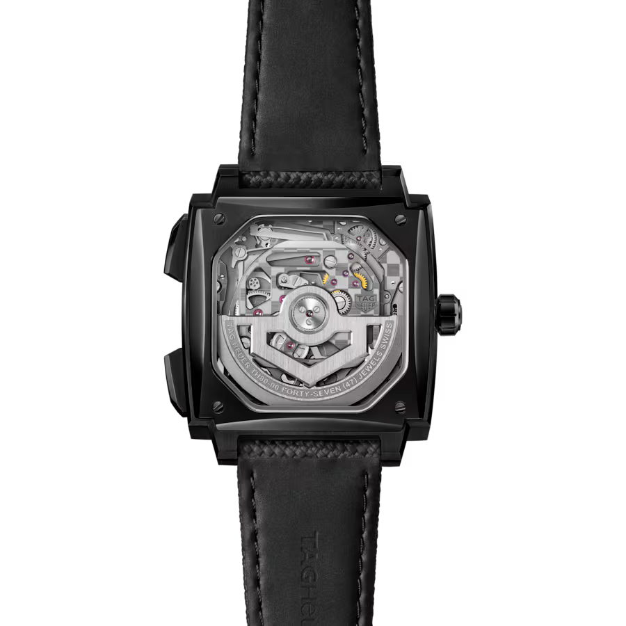 Square black watch with visible mechanical movement through crystal caseback and black leather strap.