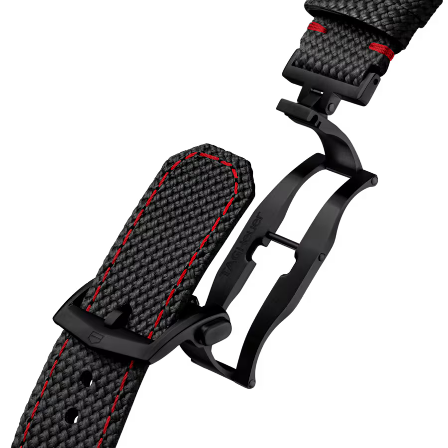 Black textured watch strap with red stitching and black buckle clasp shown open and closed.