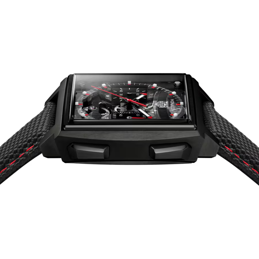 Black rectangular sports watch with red hands, black dial, red stitching on black rubber strap, displayed front-facing.