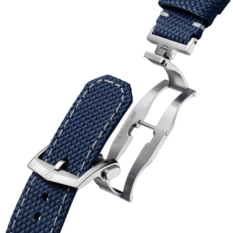 Navy blue woven fabric watch strap with white stitching and silver-tone metal buckle and lugs.